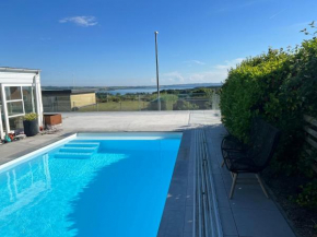 House with heated pool and great sea view Rønde